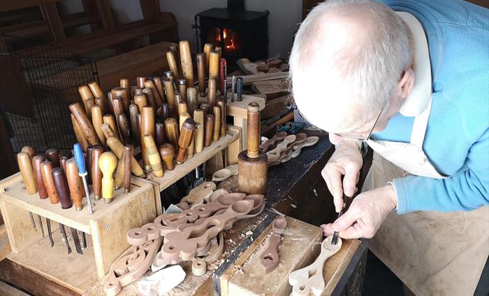 Thomas the Woodcarver at work.